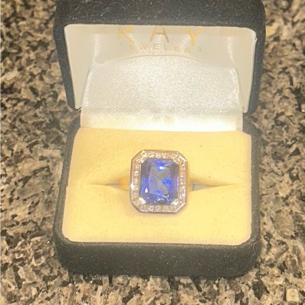 A 14K white/yellow gold synthetic sapphire and diamond ring. "cross posted "